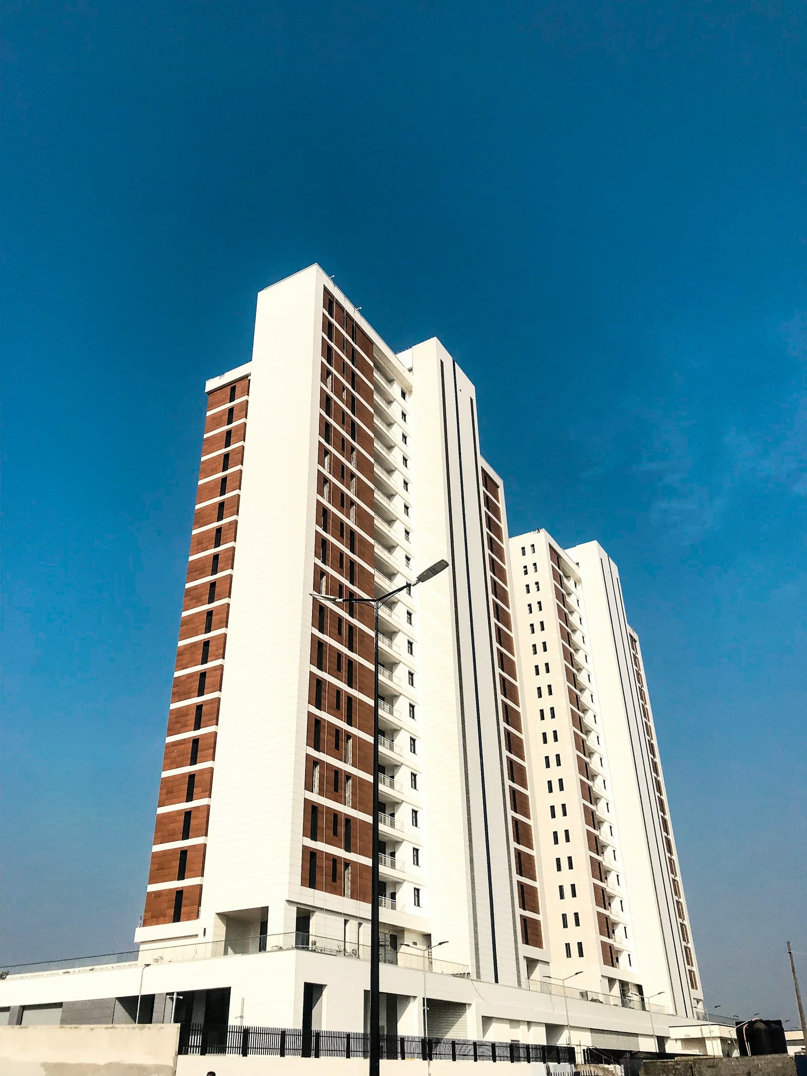 Residential towers in Lagos against a blue sky